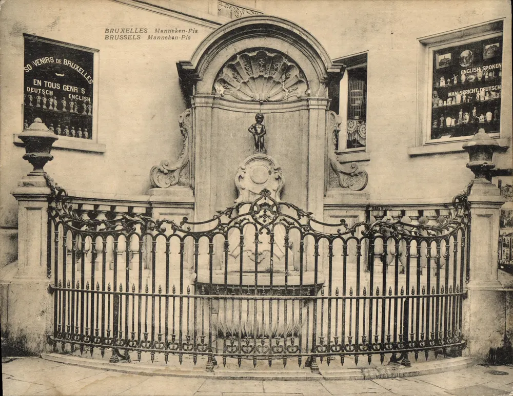 Kleiner Mann von Brügge in Brüssel — Statue eingerahmt von einem kunstvollen Eisenzaun - Vorderseite