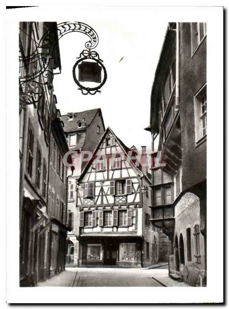 Colmar - A rua Mercière — vista da rua com casa com colmios e letreiro de 'Küchel' - Frente