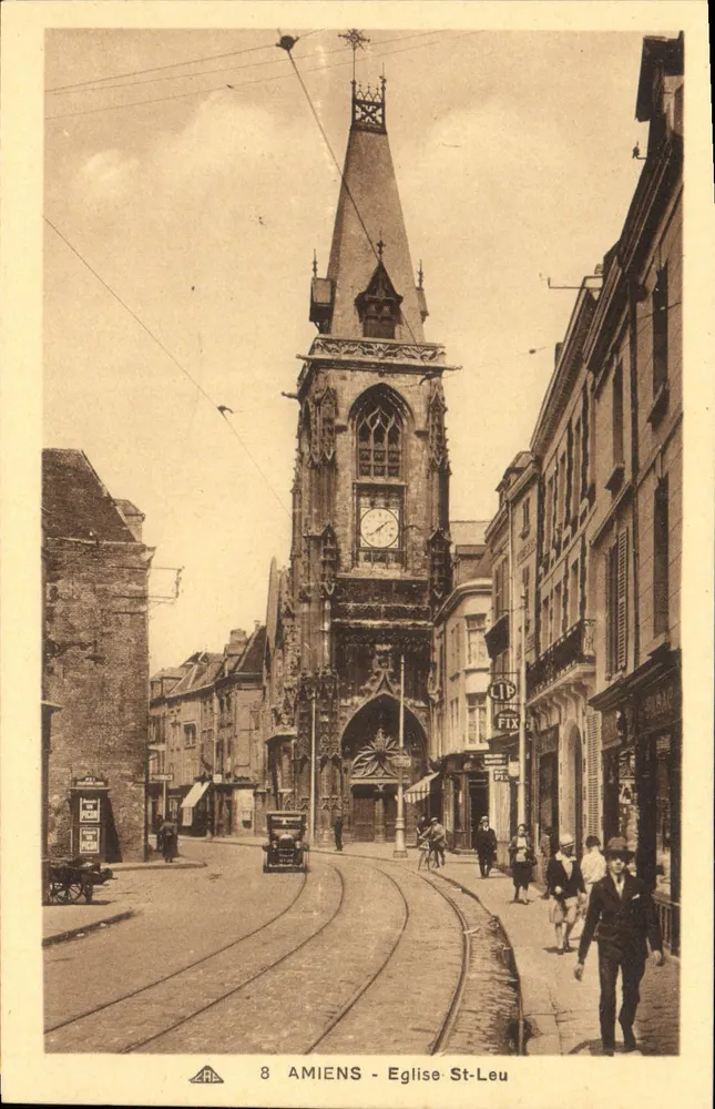 Amiens - Kościół św. Ludwika — widok wieży z zegarem i tramwajami - Awers