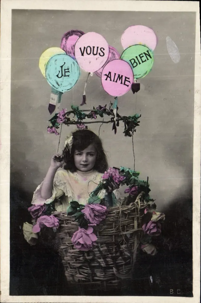 Menina em um cesto de flores — balões formando 'Je vous aime bien' — B.C. (editor) - Frente
