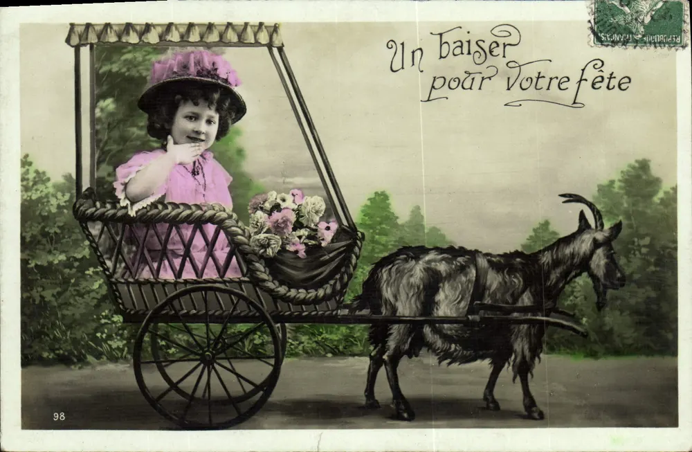 Mädchen in einem Kinderwagen, gezogen von einer Ziege — Ein Kuss zu Ihrem Fest — unbekannter Verleger, Nr. 98 - Vorderseite