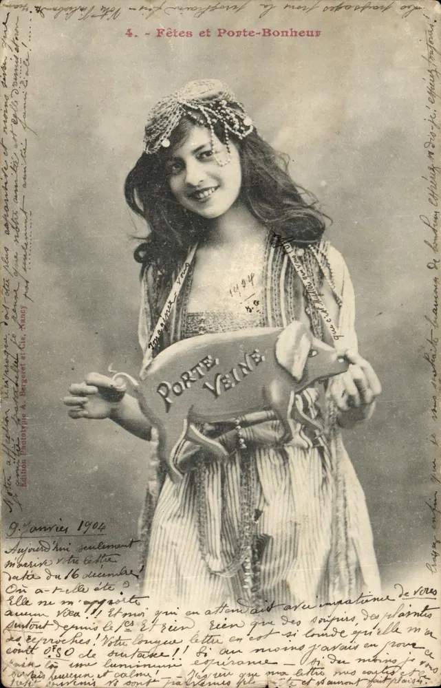 Fêtes et Porte-Bonheur — jeune femme en costume exotique tenant un porcelet porte-bonheur — édition A. Bergére & Cie, Xanuy - Vorderseite