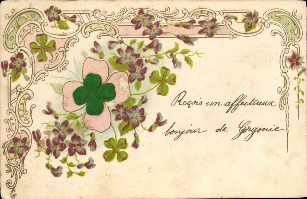 Carta postal decorativa com folhas de trêfola — texto manuscrito 'Receba um afetuoso cumprimento de Gorgonie' — editor não identificado - Frente