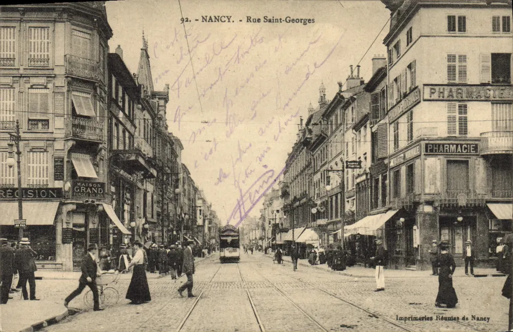 NANCY - Rue Saint-Georges — Ansicht der Straße mit Straßenbahn und Geschäften — Imprimeries Réunies de Nancy, n° 92 - Vorderseite