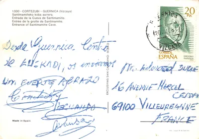 Entrée de la grotte de Santimamiñe — Portail métallique orné, inscription 'SANTIMAMINE' et plaque d'inauguration du 2 juin 1973 — Éditeur : EXCLUSIVAS SAN CAYETANO — पीछे