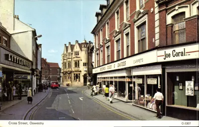 Cross Street, Oswestry — vista da rua com lojas — E. W. DENNIS & SONS LTD.