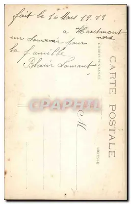 Famille assise sur un seuil — devant un mur de briques et une fenêtre — éditeur 'CARTE POSTALE' (verso) — Verso