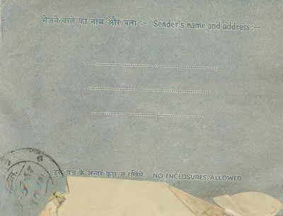 Binnenlandse brief uit India — tekst in devanagari en Engels — zegel van 10 annas — Achterkant