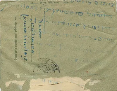 Binnenlandse brief uit India — tekst in devanagari-schrift — zegel van 14 annas — stempel DELHI — Achterkant
