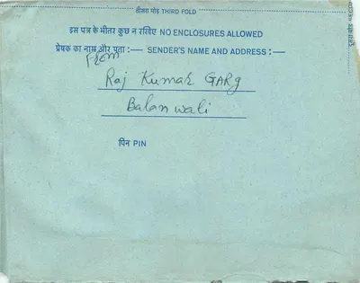Carta postal interna indiana — texto em hindi e inglês — selo de 20 annas — destinatário em Pune — Verso