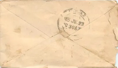 Carta postal indiana — texto em escrita devanagari — selo verde e carimbo postal — Verso