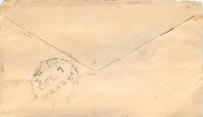 Carta postal indiana — endereço manuscrito em malayalam — selo verde 'Half Anna' e carimbo postal — Verso