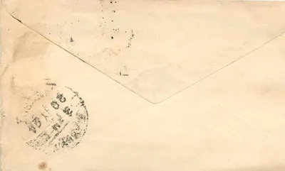 Indyjska kartka pocztowa — tekst w pismie devanagari — odbiorca w Baraut (Meerut) — znaki pocztowe i pieczątki — Rewers