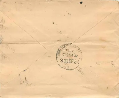 Carta postal indiana — texto em escrita devanagari — selo de um anna e carimbo postal de Delhi — Verso