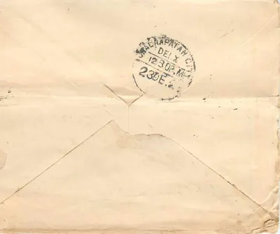 Postcard from Ceylon — text in Sinhala script — Indian postage stamp and Deli postmark — Back