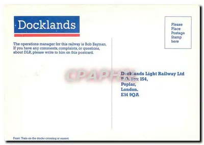 Trem nos docks — pôr do sol — Docklands Light Railway Ltd — Verso