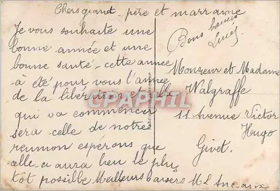 Młoda kobieta w zielonej sukni trzymająca bukiet — E.M. 404 — Rewers