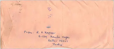 Tarjeta postal aérea de Delhi a Iowa City — R. K. Kapoor — sellos de 200 y 25 años, sello de Delhi — Reverso