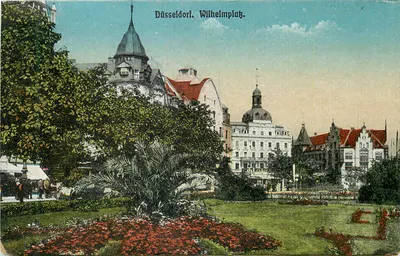Düsseldorf. Wilhelmplatz — vista da avenida com jardins e edifícios — editor não identificado