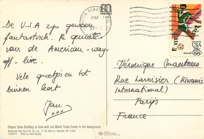 Empire State Building, Nowy Jork — widok zachodzącego słońca z World Trade Center w tle — Manhattan Post Card Pub., Inc. — Rewers