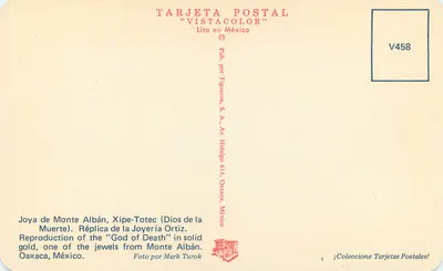 Joya de Monte Albán, Xipe-Totec (Bóg Śmierci) — Reprodukcja z złota — Figueroa, S.A. — V458 — Rewers