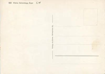 Mężczyzna z gajanką przed góra Eiger — seria 802 — wydawca A. Kiener, Schwanden GL — Rewers