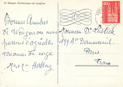 Wengen, Dorfstrasse mit Jungfrau — widok zasypanej śniegiem ulicy z górami na tle — Foto Jul. Burch, Wengen — Rewers