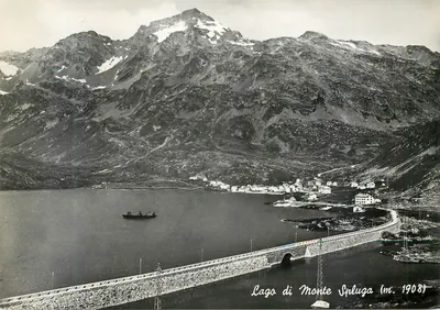 Lago di Monte Spluga (m. 1908) — vista panorâmica com lago, ponte e montanhas nevadas — editor Ed. e Fot. A. Pasina - Chiavenna