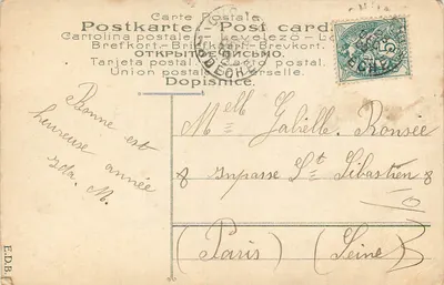 Femme en robe ornée — portrait studio — éditeur E.D.B. n° 323 — Verso