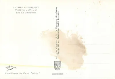 Colmar — wąska ulica z domami z cegły z wydrążonymi pionami — wydawca L'Alsace Pittoresque, n° 63.066.136 — Rewers
