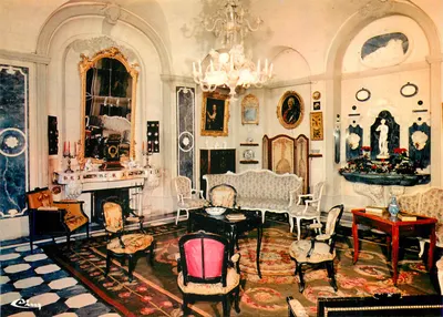 Interior of a luxurious salon — baroque decor with gilded mirror, fireplace and chandeliers — publisher Cing, series number not visible