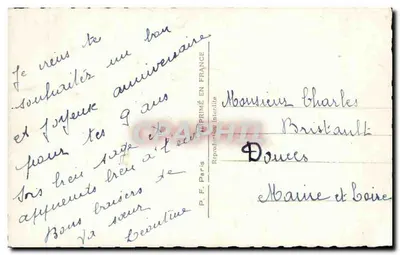 Uśmiechnięta dziewczyna z koszykiem kwiatów — ramka kwiatowa ozdobiona — P.F. 909 — Rewers