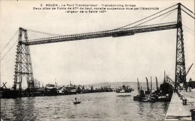 Rouen - O Ponte Transbordeur — ponte suspensa com duas pilares de 67m de altura, cabine suspensa movida por eletricidade, largura do rio Sena 140m