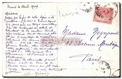 Scena uliczna w Tunisie — brama kamienna i handlarze — Rewers