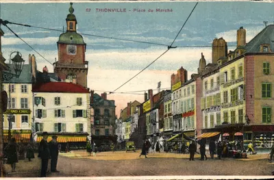 Thionville - Place du Marché — vista da praça com a torre da igreja e comércios — editor: Thionville, n° 62