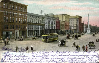 Augusta, GA. Broad Street — vista urbana com trem e monumento — editor Art Publishers