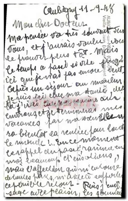 Casa com colmios em Aubigny-sur-Nère — fotografia assinada 'Rimy' — verso: carta para um médico datada de 11-9-48 — Verso