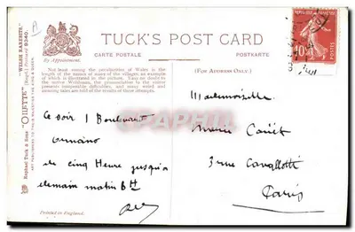 Um viajante diante de um painel de escolha de rotas — Llanarmonnyddmawr / Llanarmondyffrynceiriog — editor Tuck & Sons, n° 9340 — Verso
