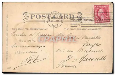Jeune femme souriante — tenant un bouquet de lilas — éditeur Schlesinger Bros. N.Y. — Verso